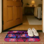 detroit-pistons-palm-silhouette-red-black-doormat-best-selling.webp