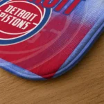 detroit-pistons-pixel-blur-red-doormat-best-selling.webp